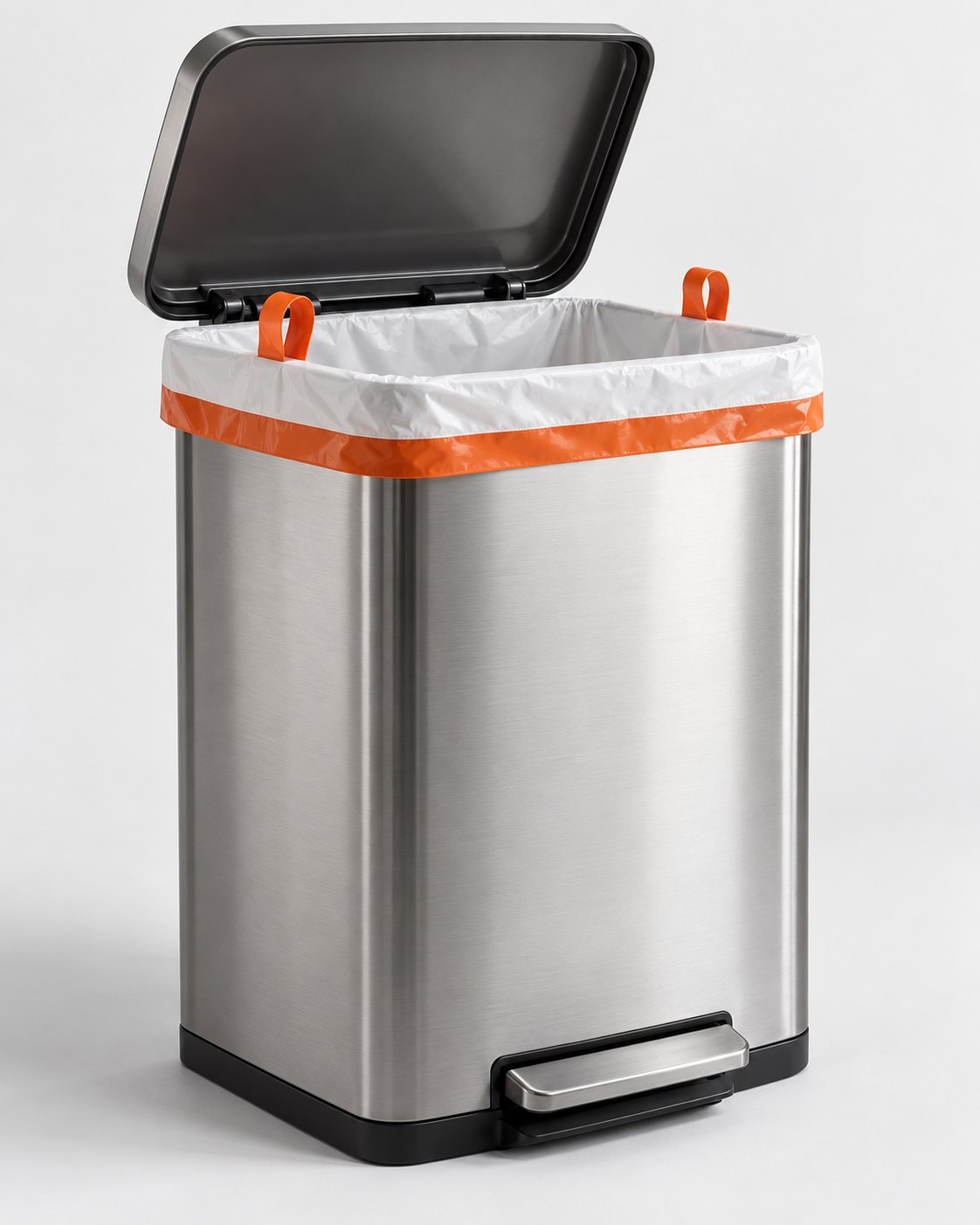 BinDone liner fitted in a brushed steel step can with the lid open, orange hem band and two orange lift loops